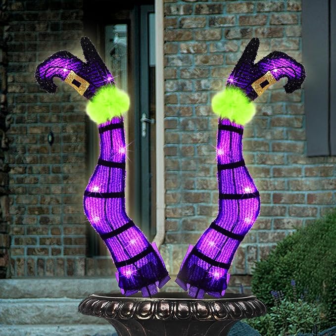 Wicked witch legs Halloween yard decor with purple tinsel and stakes, battery operated with timer and 8 light modes