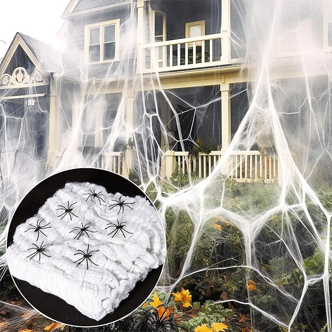 Halloween spider web decorations with fake spiders for outdoor spooky decor.