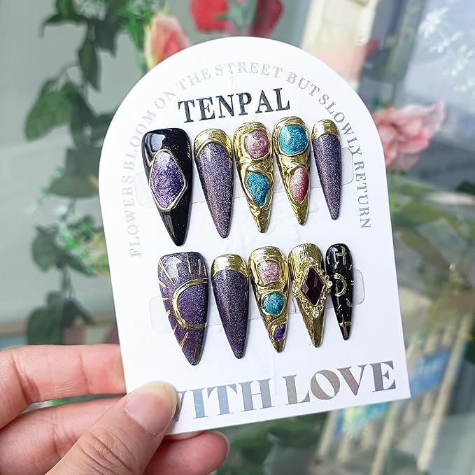 Handcrafted long stiletto press on nails with cat eye designs, gold and purple glossy finish