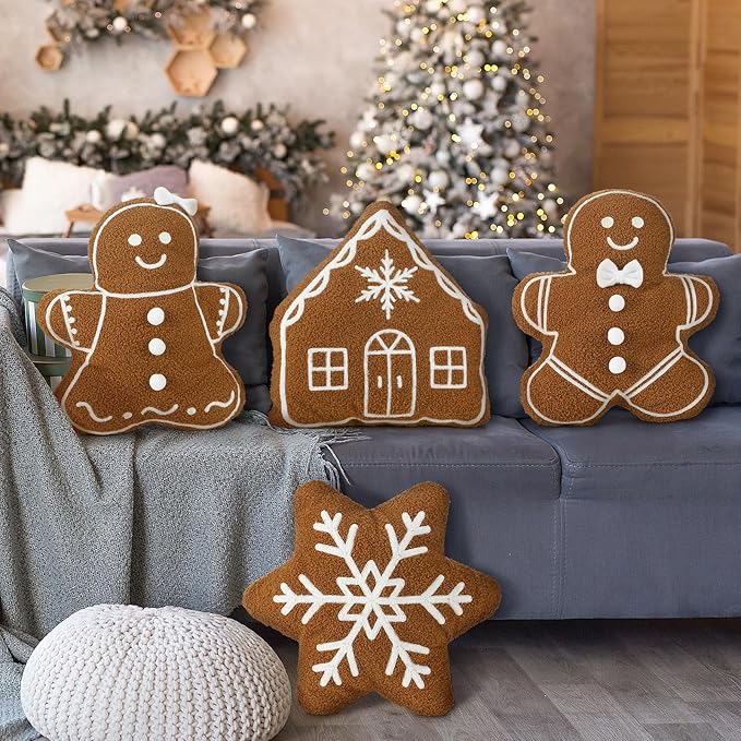 Christmas throw pillows set featuring plush gingerbread men, gingerbread house, and snowflake shapes for festive decor.