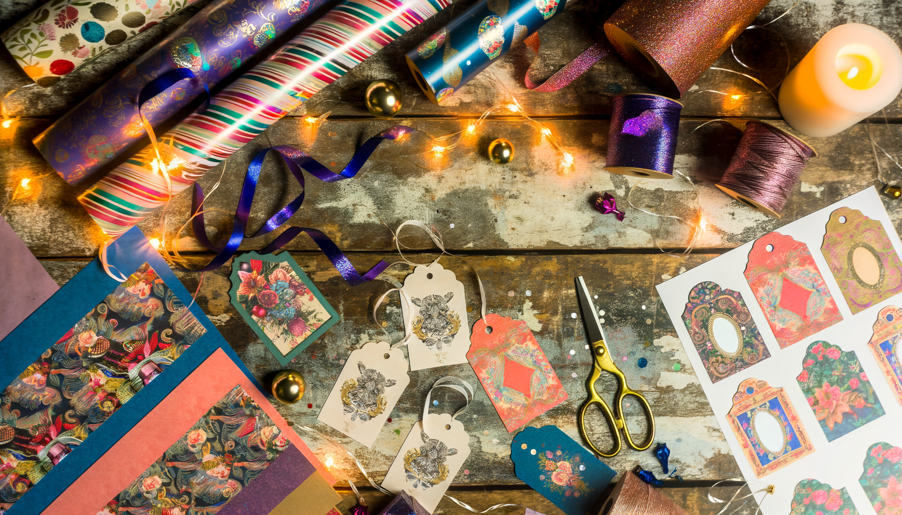 Elegant printable gift tags on festive Christmas crafting scene with ribbons and fairy lights.